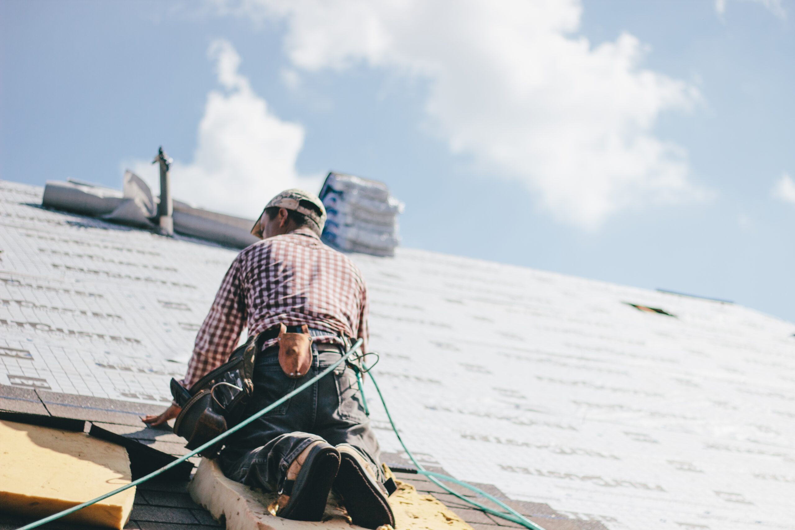roofer-installing-shingles-on-residential-building-2026-03-17-05-01-16-utc